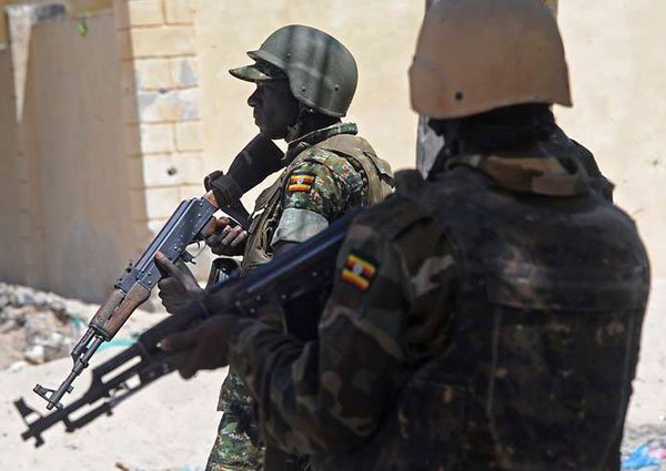Ugandan soldiers patrol a backstreet in the southern town of Merka, 90kms north of Somalia's capital Mogadishu, on July 17, 2016, as part of the African Union Mission in Somalia (Amisom). The country's foreign minister has said that Amisom has contributed to the declining dominance of Al-Shabaab.