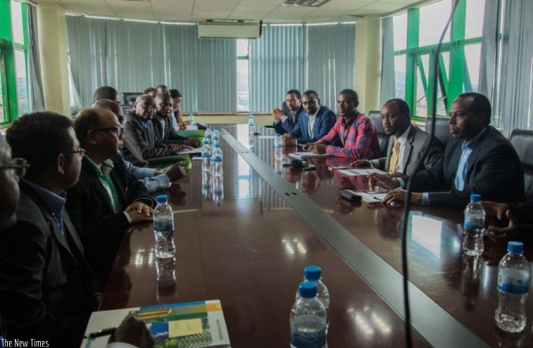 Evode Imena (2nd right), the state minister in charge of mining addresses investors during the contract signing ceremony yesterday.