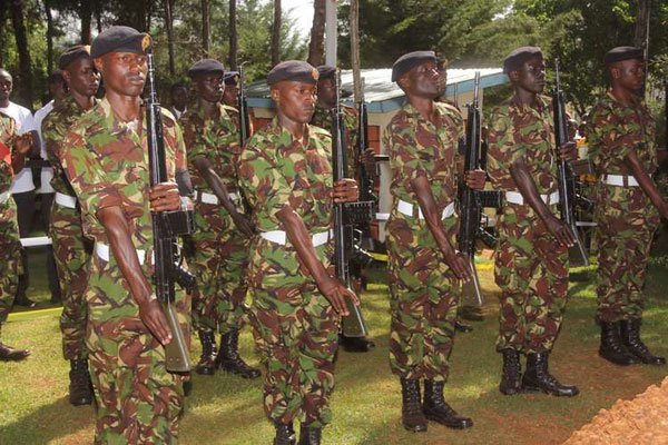 Soldiers at the burial of their colleague, Wesley Sirikwo, at Lelmokwo, Nandi County, on February 3, 2016. The President has defended the Kenya Defence Forces from accusations by a team of UN investigators that they were engaging in illegal activities.