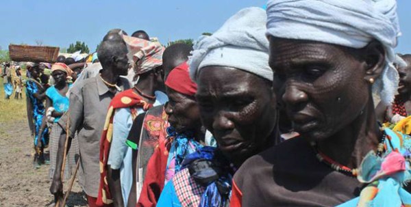Elderly women and men in Koch County Unity State queue to register with United Nations World Food Programme (WFP) officials to receive food supplies, in South Sudan on September 25, 2015.