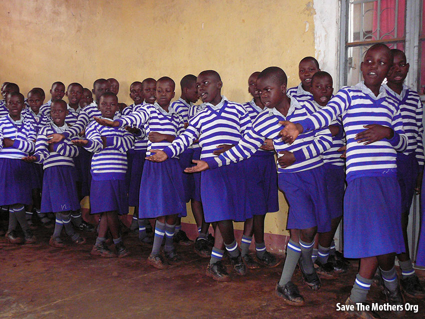 Students of Save the Mothers graduates sing for mothers.