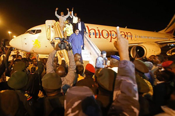 Freed Sudanese prisoners, who had been captured by SPLM-N, react upon their arrival at Khartoum airport on March 5, 2017.