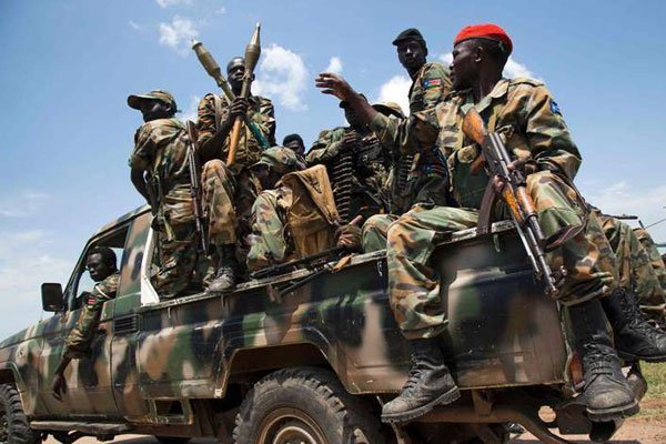 Soldiers of the Sudan People Liberation Army sit in a pick-up truck at the military base in Malakal, northern South Sudan, on October 16, 2016.