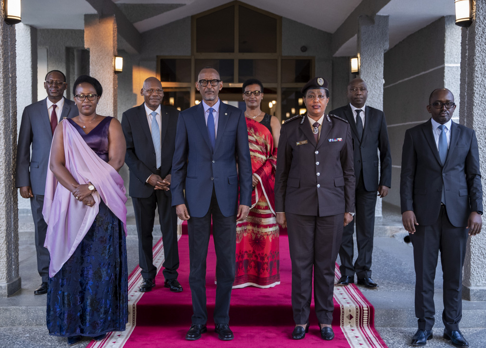 Newly appointed officials posing for a photo with President Paul Kagame after the swearing-in ceremony.