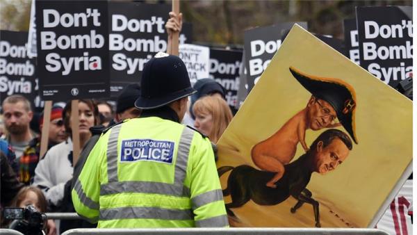 Demonstrators protest against British bombing of Syria outside Downing Street in London on Saturday