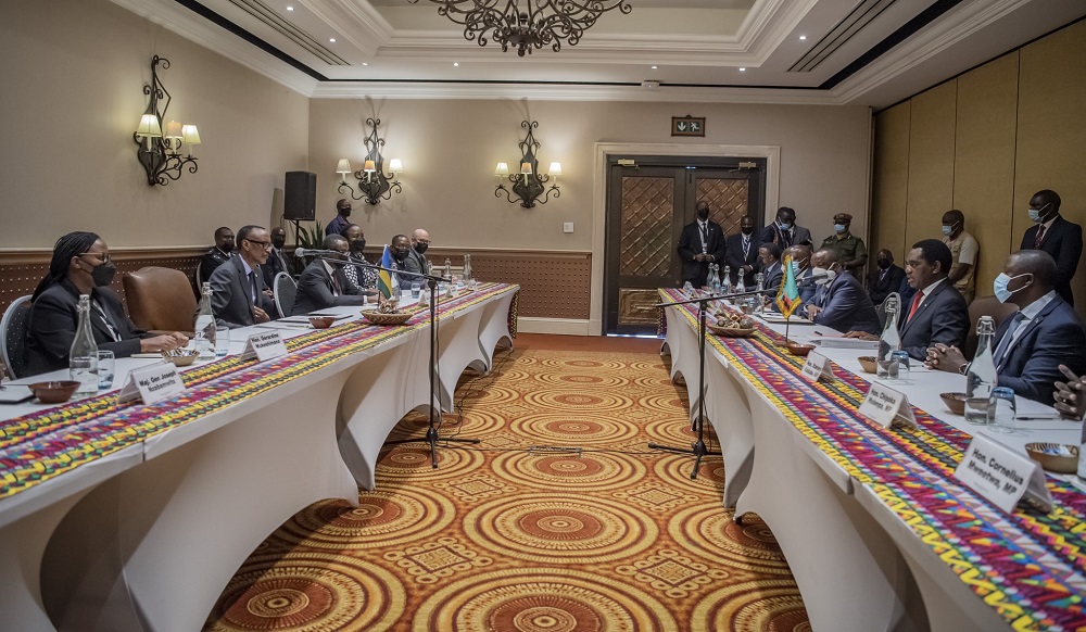 The delegations from Rwanda and Zambia in discussions after signing agreements.