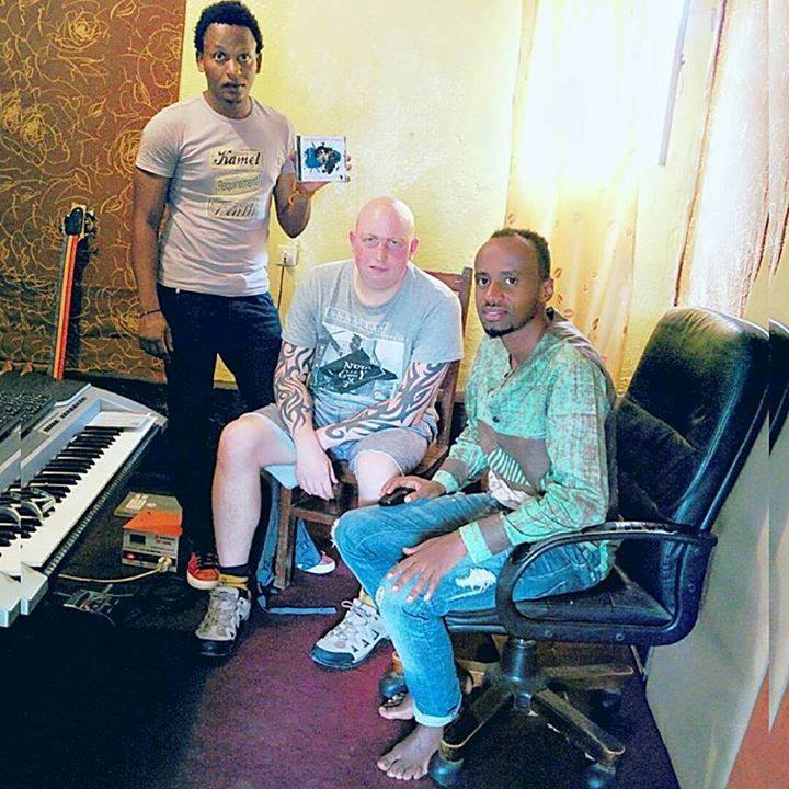 Tom Wardle (C) met Chrespin (L) in September, 2017 in Kigali