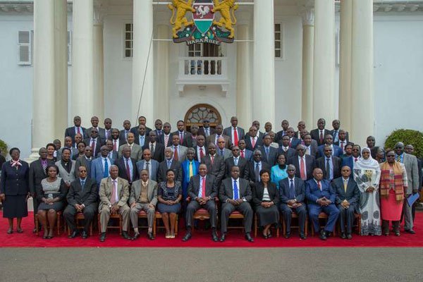 President Uhuru Kenyatta (centre, sitting) with vice-chancellors of public and private universities and other officials at State House in Nairobi on August 16, 2016.