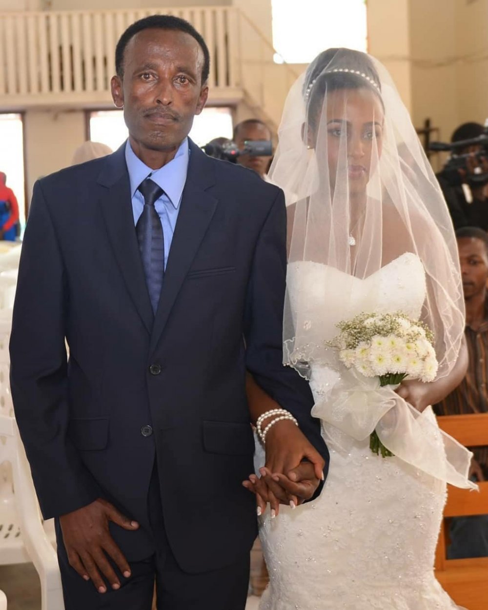 Tricia with her father on wedding day.