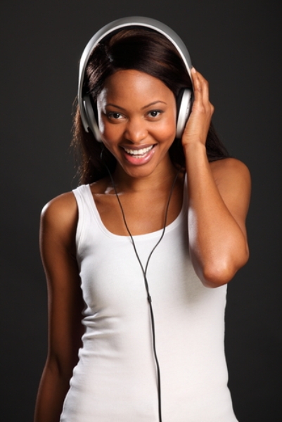 A woman listening to music on headphones  