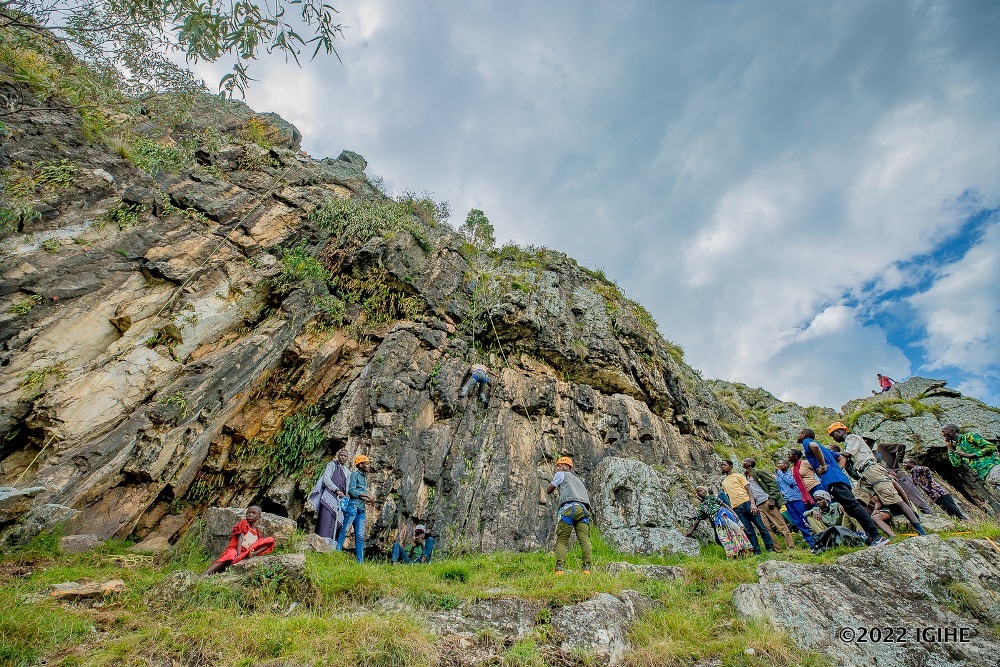 Participants of the campaign climbing Mpushi Rock.  
