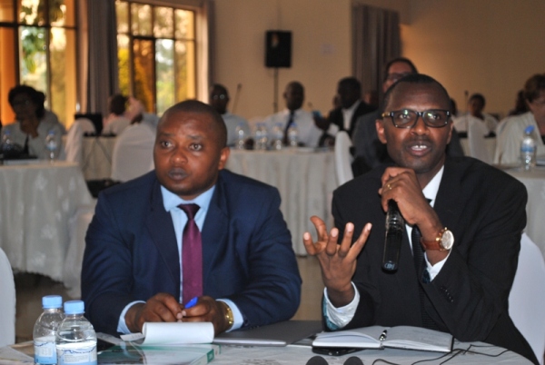 The state Minister in charge of primary and secondary schools ,Olivier Rwamukwaya with the Minister of Education, Dr Musafiri Papias Malimba during the presentation of The Global Education Monitoring Report of United Nations Children Education Fund (UNESCO) in 2016 yesterday.