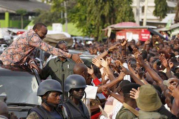President Uhuru Kenyatta addresses wananchi gathered at the Kilifi main bus terminus when he visited Kilifi County on September 2, 2016.