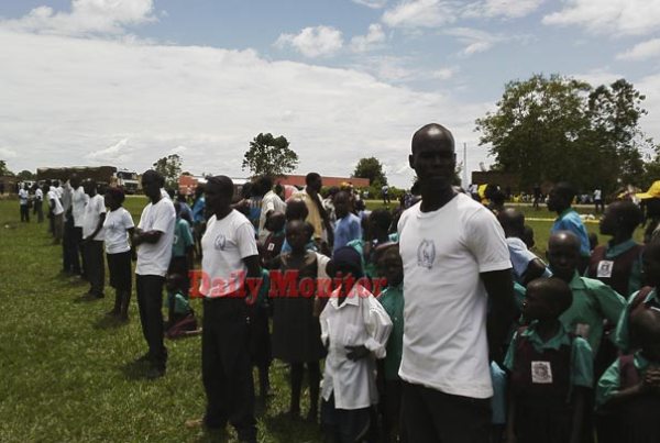 Crime preventers line up to manage the crowd at Iguli Primary School, where president Museveni is holding his campaign rally.