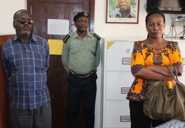 Two suspects, Mr Bahilanya Milingita from the DRC and Dr Esther Simon Mwenitumba from Malawi presented to journalists yesterday after they were nabbed by the Immigration Department for being in the country illegally. Mr Milingita was working with Tanesco while Miss Mwenitumba worked as the Chief Medical Officer at Mburahati Centre. (Photo by Eliphace Marwa - Maelezo)