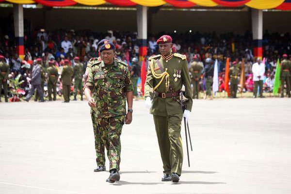 President Uhuru Kenyatta accompanied by the acting Deputy Inspector-General of Police Joel Kitili after inspecting a guard of honour at the Embakasi General Service Unit Training College during a pass out parade in Nairobi on March 1, 2016.