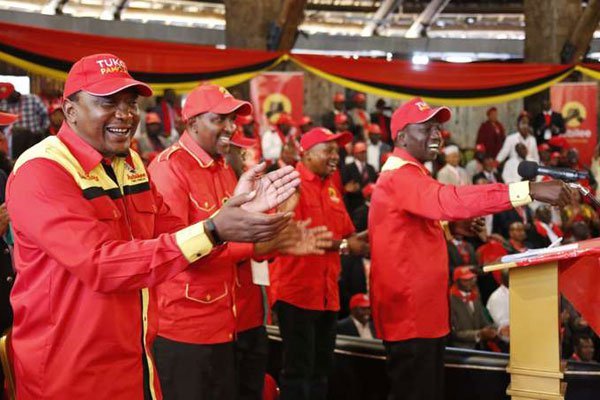 President Uhuru Kenyatta (left), Aden Duale (second from left), the majority leader in the National Assembly, Deputy President William Ruto (right) and other leaders at Jubilee Party's national governing council meeting at Bomas of Kenya in Nairobi on November 4, 2016.