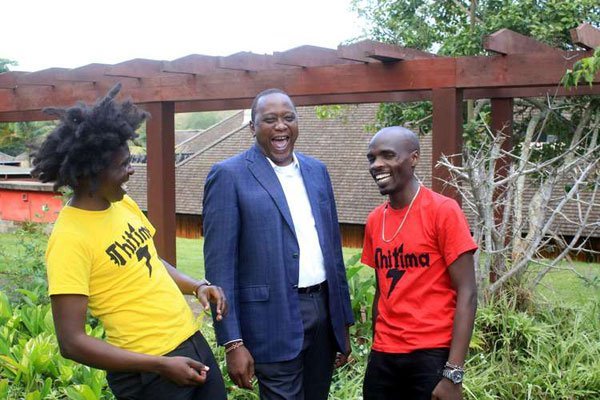 President Uhuru Kenyatta shares a light moment with William Kamore (left) and Moses Kariuki of Thitima anthem at Sagana State Lodge, Nyeri County on January 22, 2017.