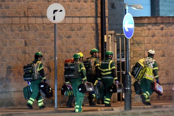 Medics arrive at the scene of the suspected explosion at an Ariana Grande pop concert in Manchester, Britain, on May 22, 2017.