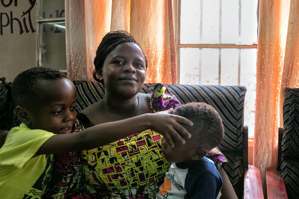 Umutoni Denise, 30, is a regular churchgoer at Victory Church in Nyakabanda, Kigali, Rwanda. Today she brought her four children to hear the Ebola preparedness sermon by Reverend Liberatha Uwamariya.