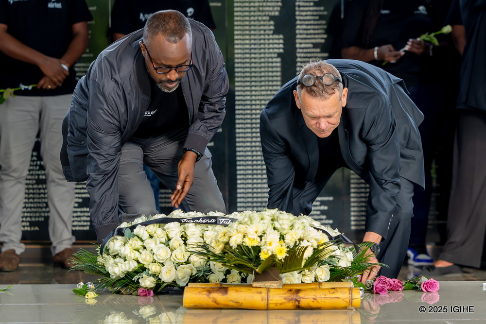The Managing Director of Airtel Rwanda, Emmanuel Hamez lays a wreath at the graves of victims at Ntarama Genocide memorial center.