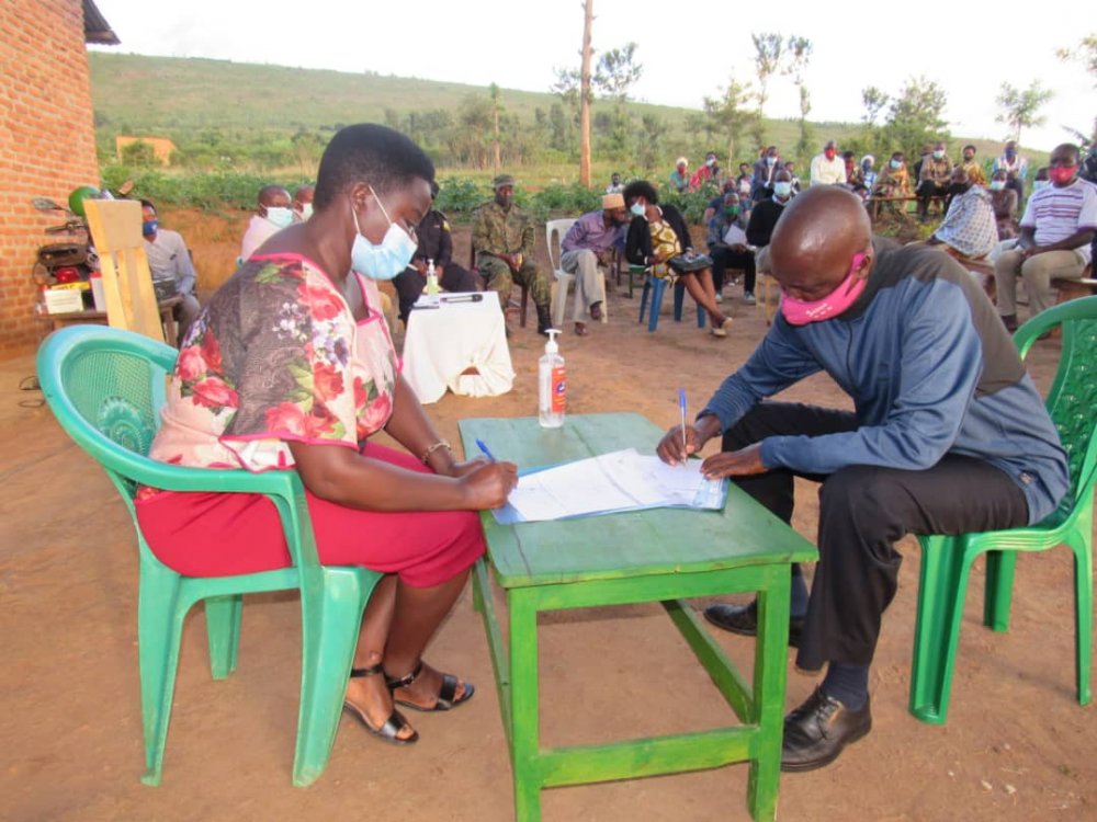 Village leaders signing performance contracts.
