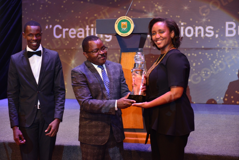 RwandAir CEO, Yvonne Makolo receiving the national carrier's award