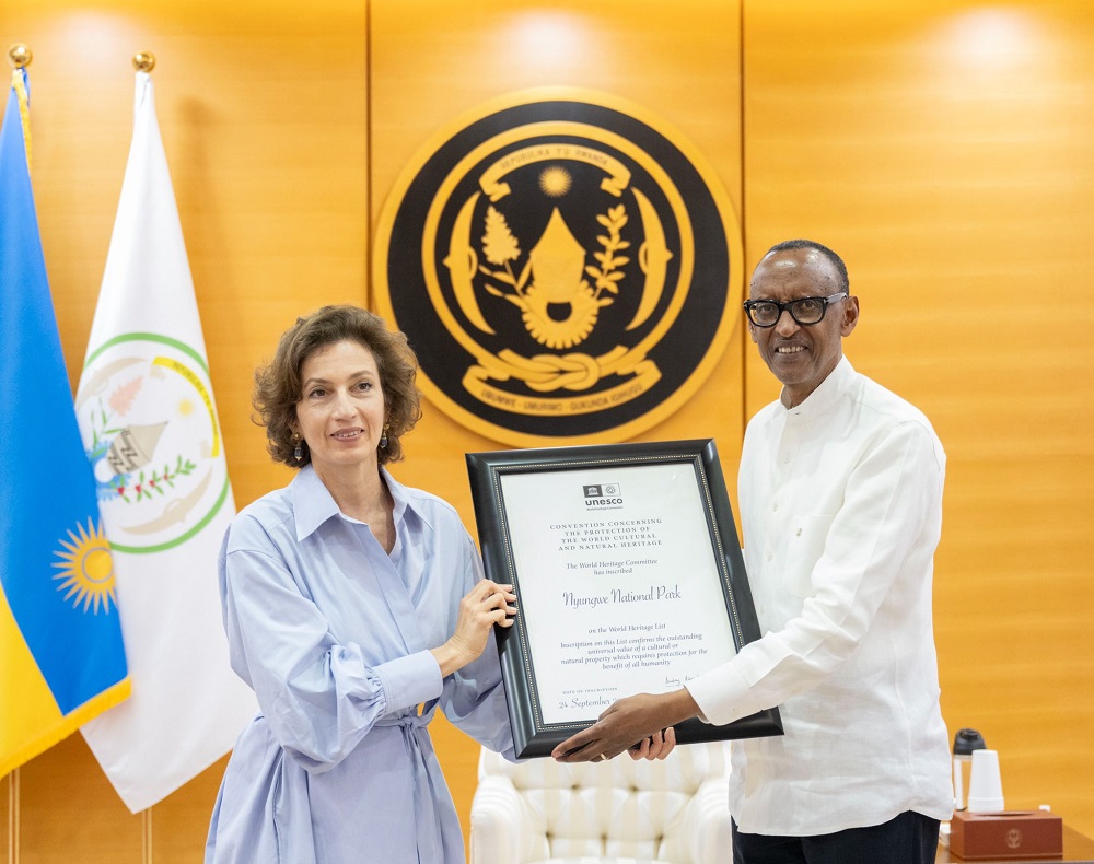 The Director-General of UNESCO, Audrey Azoulay, presents President Paul Kagame with a certificate recognizing some parts of Rwanda as a World Heritage Site.