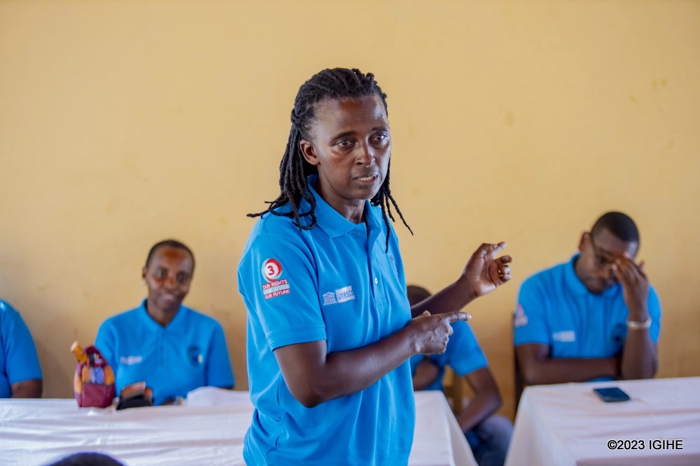 The Chairperson of AWDO yaganirinteracting with students at GS Nyamiyaga.  