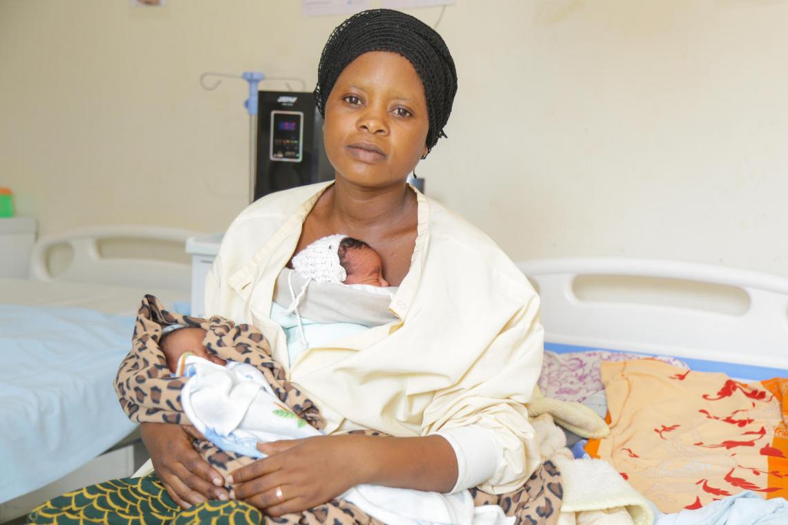 Jyamimah Nyirahabimana holds her twins, both born premature.