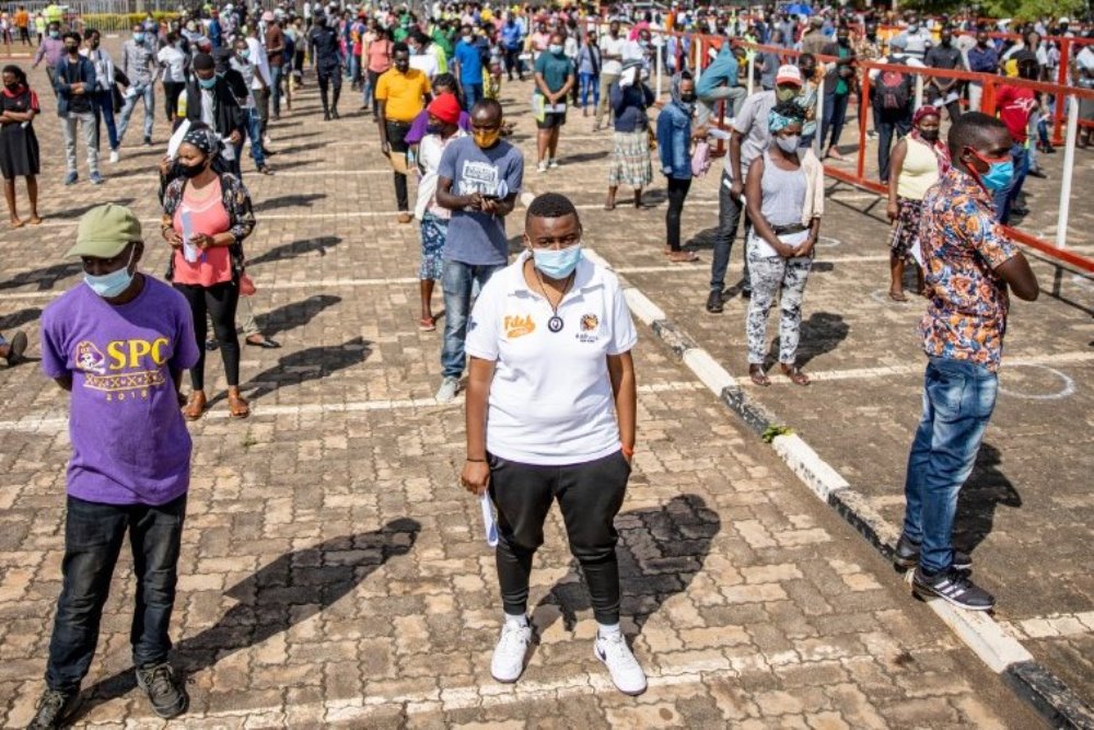 Kigali City residents lined up at one of designated sites where vaccines are administered.  