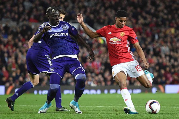 Manchester United's English striker Marcus Rashford shoots to score their second goal during their Uefa Europa League quarter-final second leg match against Anderlecht at Old Trafford on April 20, 2017.