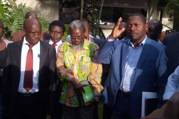 KUSU Secretary-General Charles Mukhwaya (right) addresses the media with UASU Secretary-General Constantine Wasonga (left) and UASU Chairman Muga K’Olale at Merica Hotel in Nakuru on January 6, 2017.