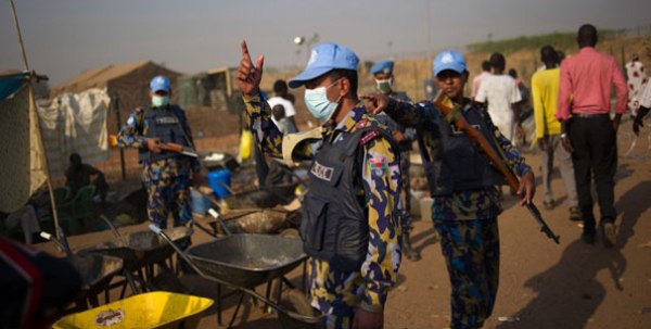 United Nations Mission in South Sudan (UNMISS) peacekeepers stand guard at an entrance to the Tongping UNMISS base in Juba.
