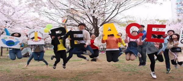 Jumping with Pickets saying "PEACE" at Bupyeong Park (South Korea)