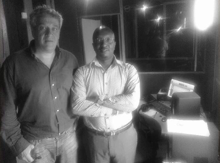 Serge Farnel and Victor Nkindi in Hooza Media recording studios.