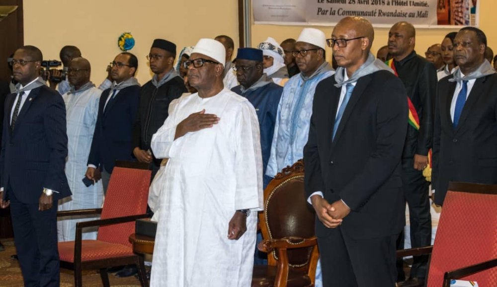 President Keita and mourners observe a minute  of silence to commemorate slain victims