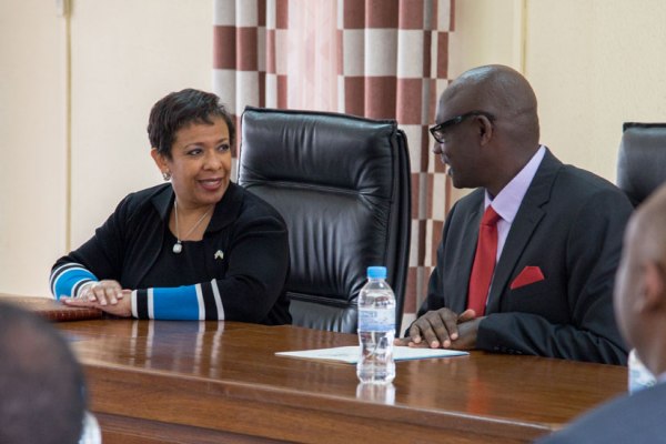 Minister Busingye speaks to Lorohnson Busiongetta E. Lynch ,United State's attorney general during the visit at the Ministry of justice's office