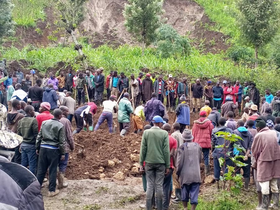 Residents of Kagogo Sector, Kabaya Cell, try to clear land after past landslides.
