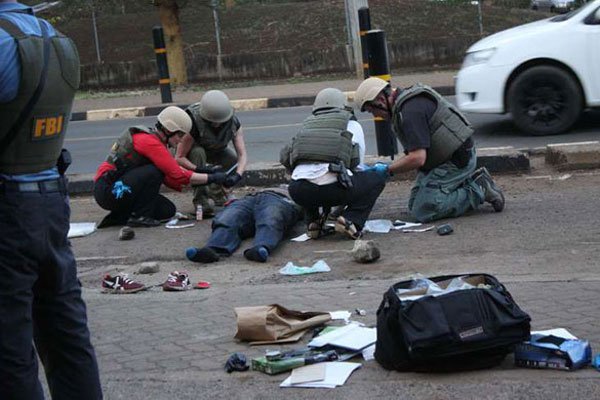 FBI detectives at the scene where a man was killed on October 27, 2016 after attempting to attack a GSU officer on duty at the US embassy in Nairobi.