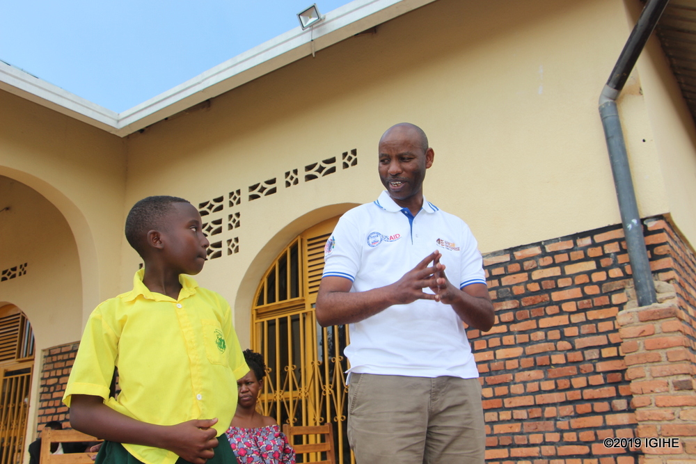 One of the underprivileged children, thanking AEE Rwanda for their support