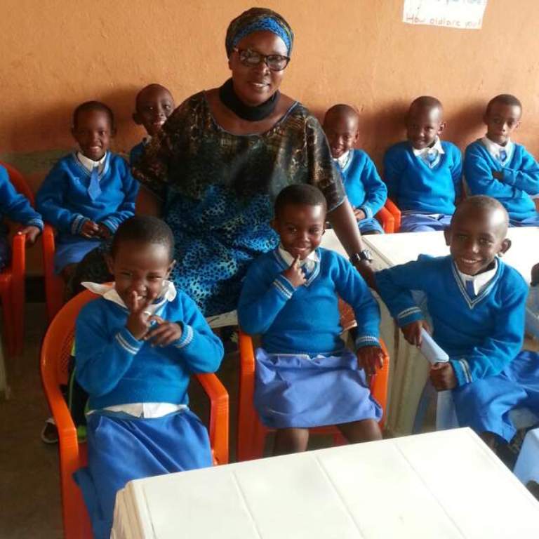 Foster mother Nzabamwita with her class