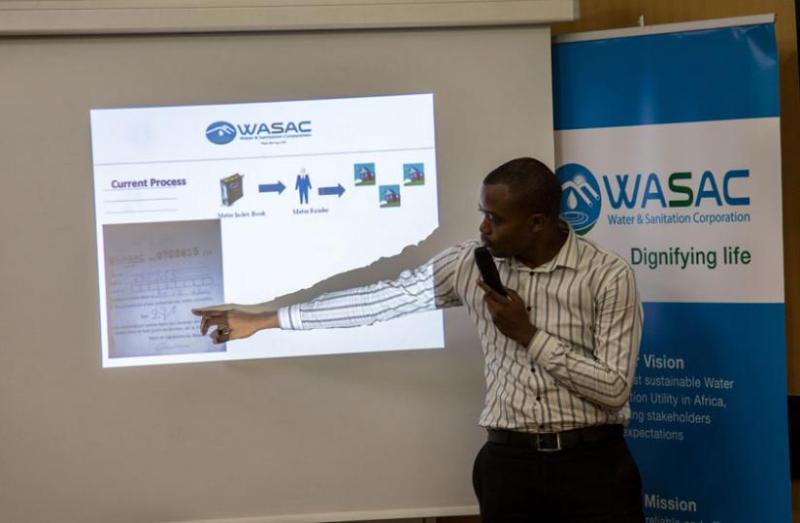 Alfred Dushimimana ICT Manager at WASAC shows an illustration on the new water electronic billing.