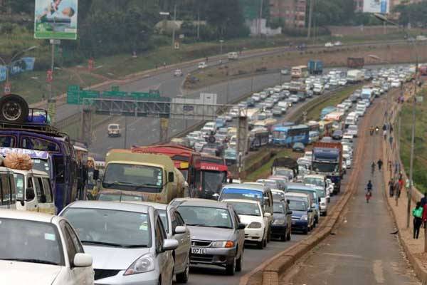Motorist held up in traffic jam on Thika Road. With a World Bank report showing that one in every four Kenyans lives in a town, housing and transport are likely to hamper the growth of Nairobi City.