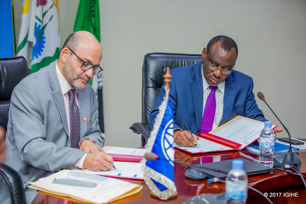 The Country Manager for World Bank Group, Yasser El Gamal (L) The Minister of Finance and Economic Planning, Amb. Claver Gatete  sign the loan