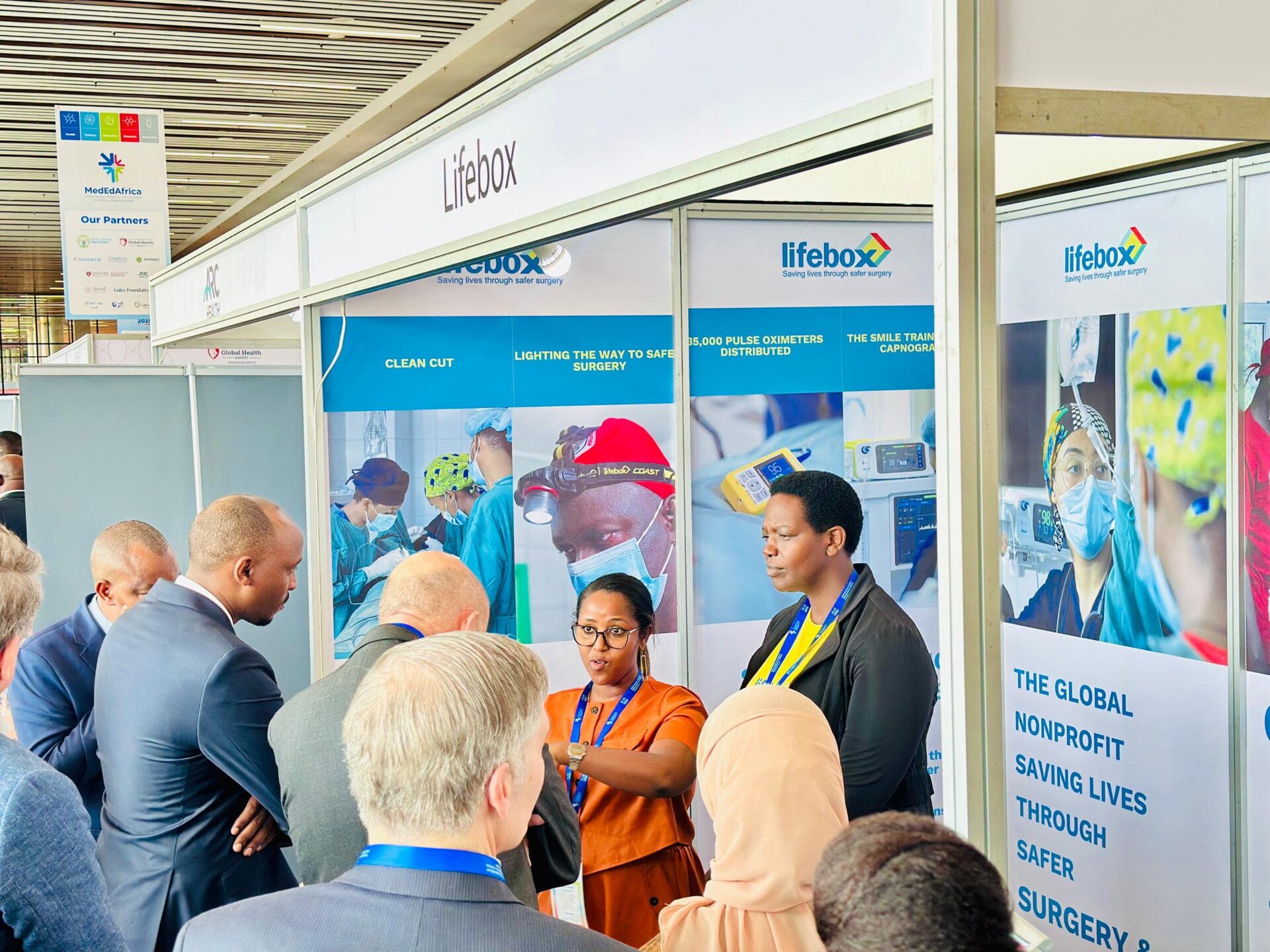 Lifebox’s Chief Program Officer, Senait Bitew, takes a team led by Health Minister Dr. Sabin Nsanzimana through their programs at the Advancing Medical Education Africa Conference in Kigali.