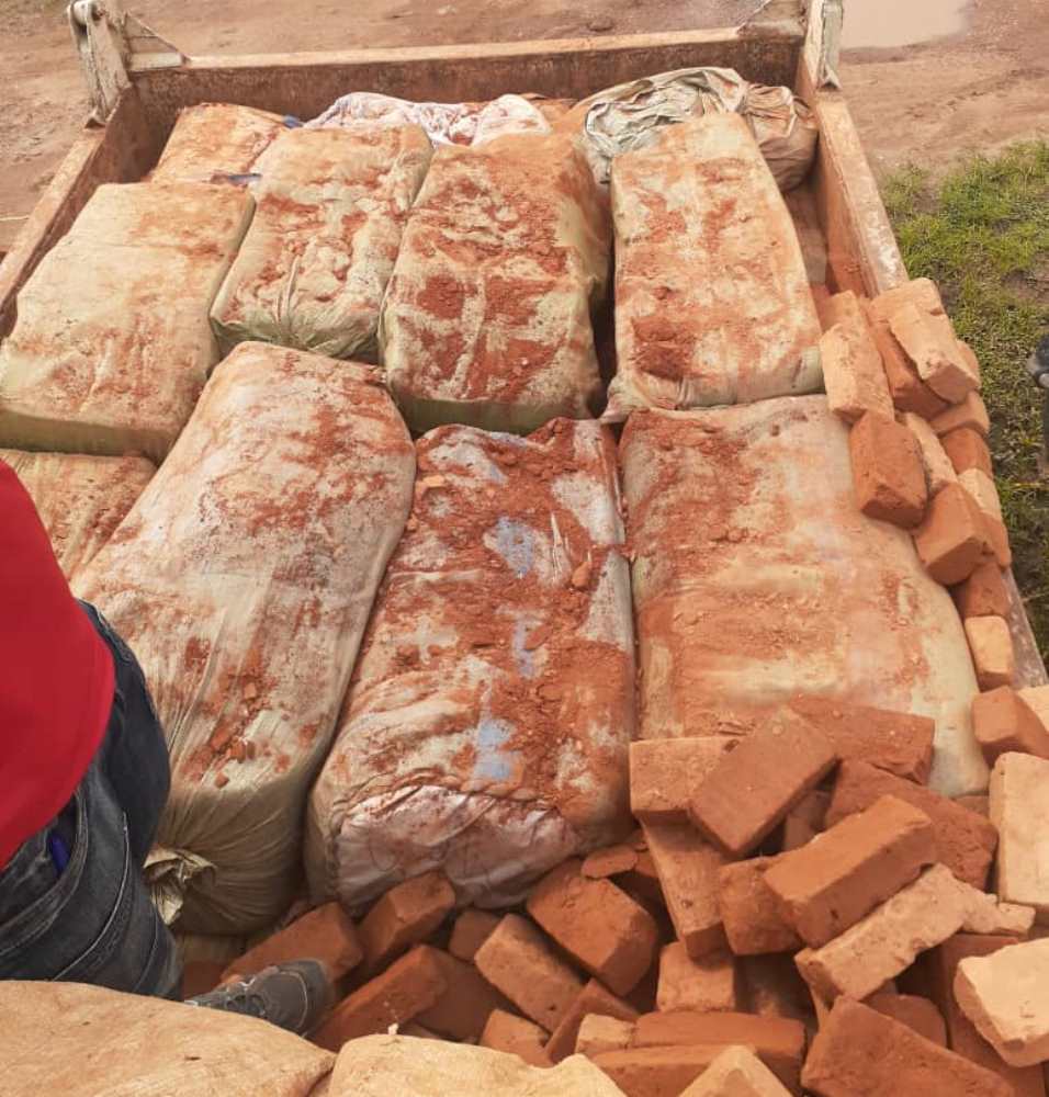The Fuso truck was loaded with sacks of smuggled goods under bricks.