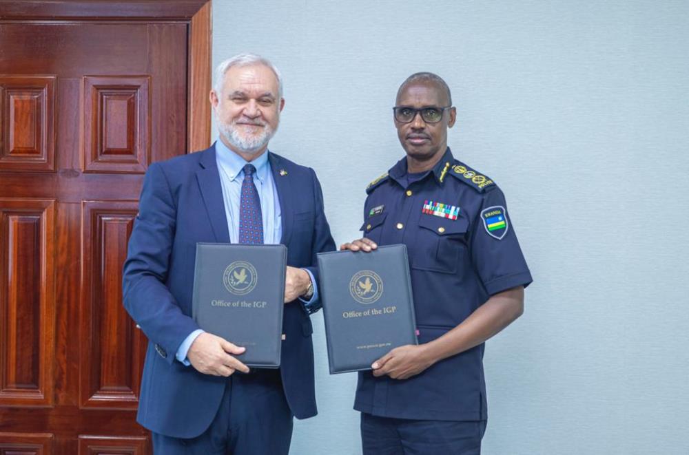 The Inspector General of Police (IGP) Dan Munyuza and Marcello Fantoni, Kent State University Vice President for Global Education after signing the agreement.