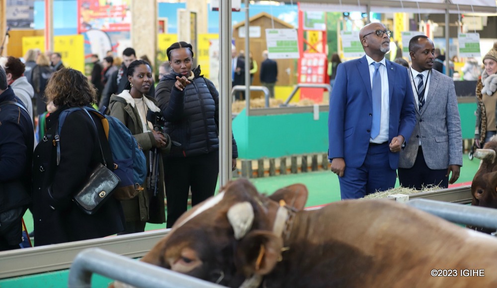 Diane Sayinzoga with Rwanda's Ambassador in France, Amb. François Nkulikiyimfura and Yves Karatwa, who is coordinating exhibitors on Rwandan side coordinator at the exhibition.  