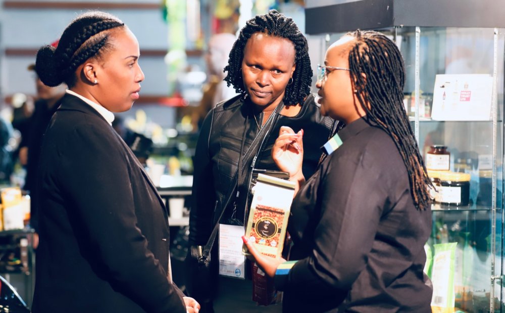 Diane Sayinzoga interacting with some of exhibitors from Rwanda. 